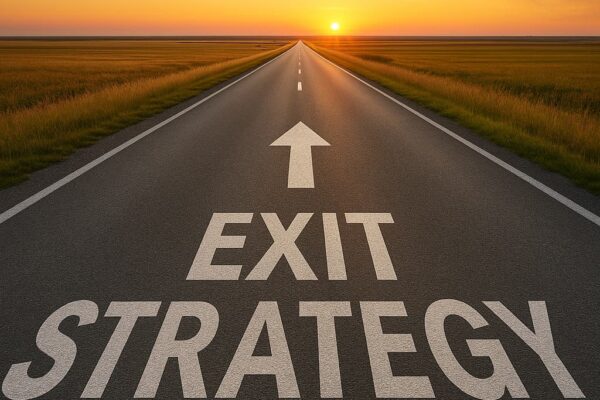 Road at sunset with arrow on the floow and exit strategy written