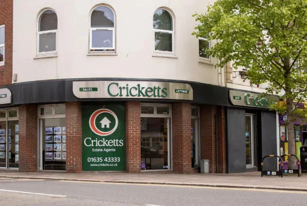 External view of a an estate agents in the high street with "Cricketts" visible